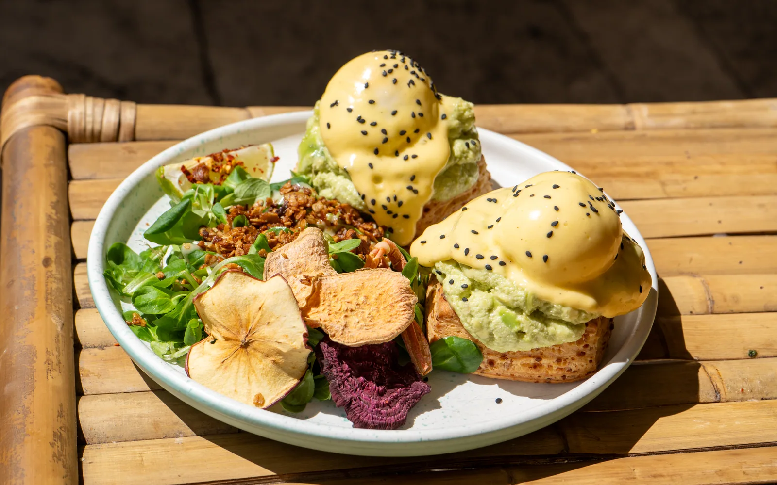 Eggs Benedict on cheddar-scones with smashed avocado and hollandaise at Cookie Beacon Budapest