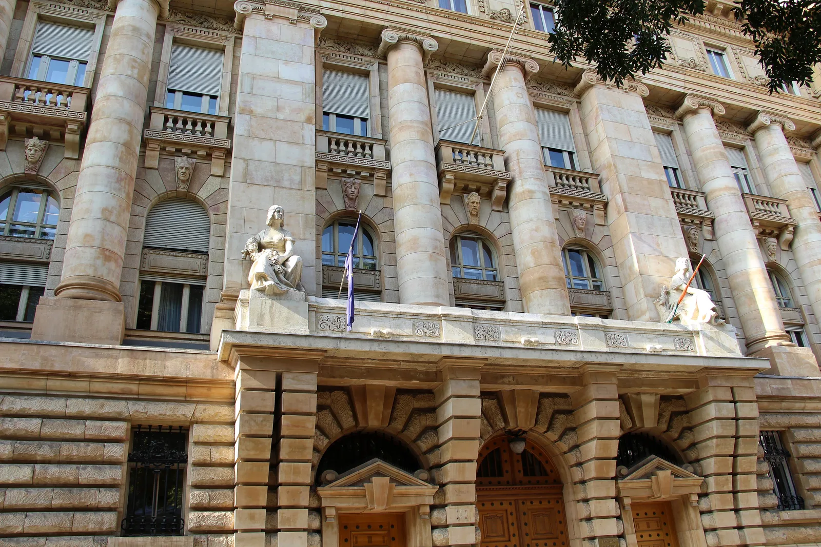 The stone facade of the National Bank of Hungary on Szabadság tér, Budapest, with columns, balconies and carved reliefs