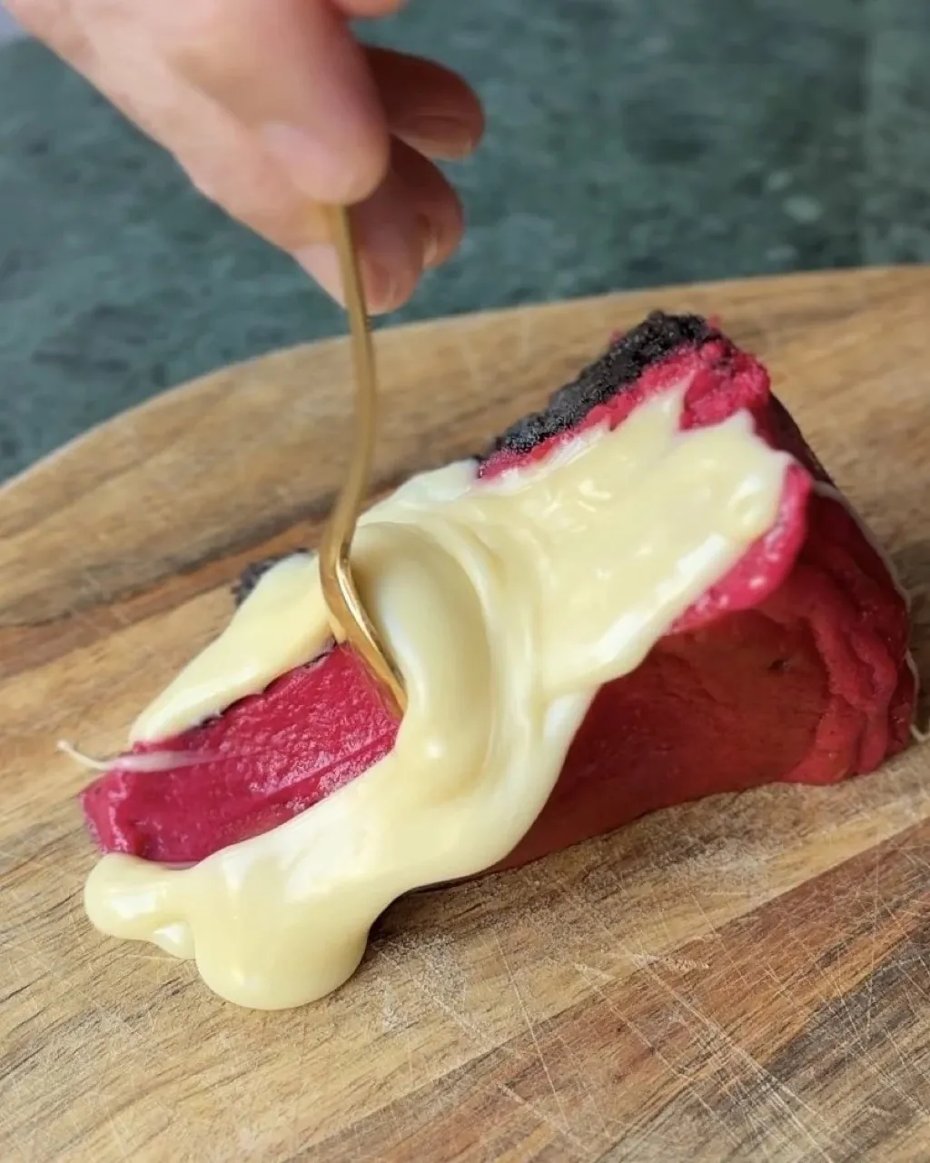 Slice of Cheesecake by Cookie Beacon with berry topping