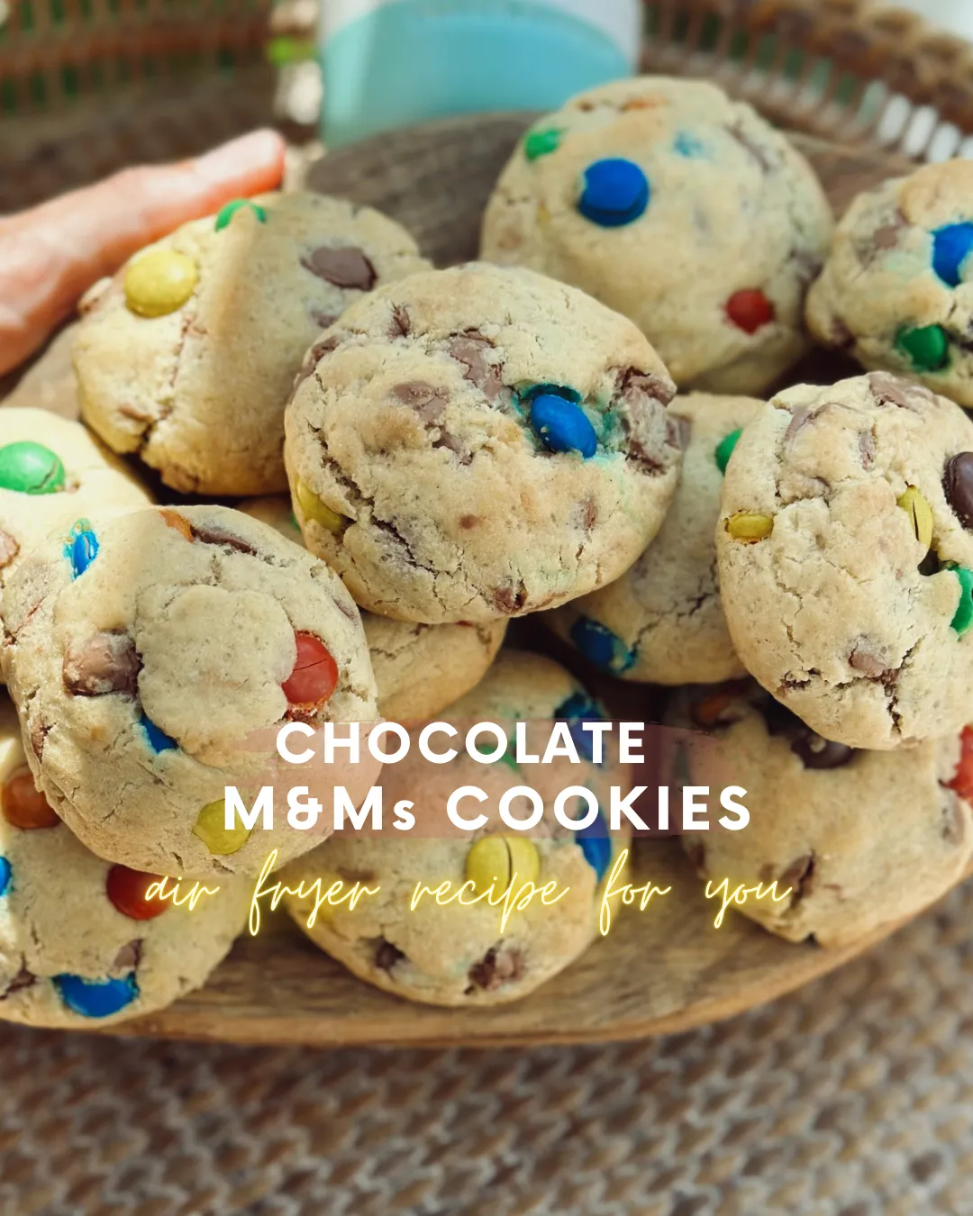 A pile of soft chocolate chip cookies studded with colourful M&M's