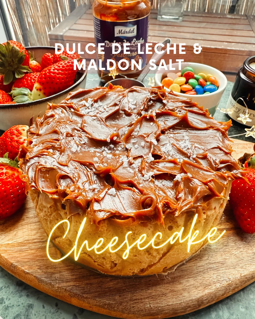Mini dulce de leche cheesecake on a golden Oreo crust, topped with Maldon salt flakes